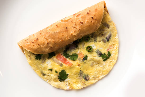 omelette / omlet / omlete chapati roll or Indian bread or roti rolled with omlet. Popular, quick and healthy recipe for kid's tiffin or lunch box