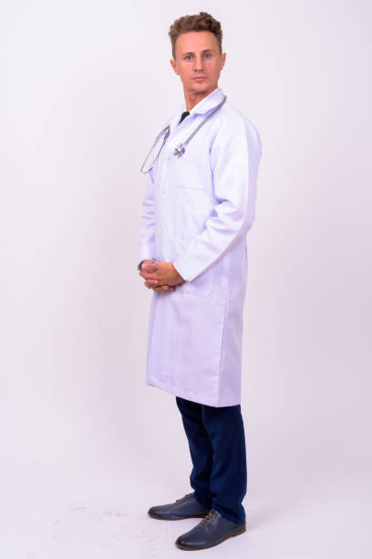 istock Man doctor against white background 898453302