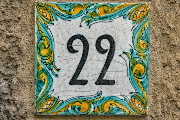 istock Ceramic number tile number 22 on italian old house 898455152