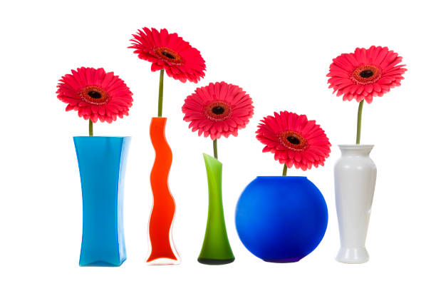 istock Multicolored vases and pink gerberas 898455222