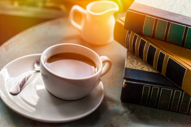 istock Coffee Cup and books on a wooden table 898456540
