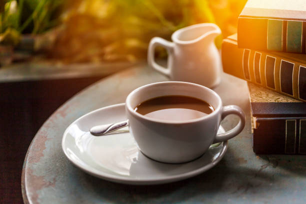 istock Coffee Cup and books on a wooden table 898456542