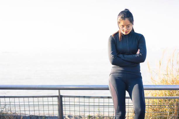 istock portrait of female runner leaning on railing 898456882