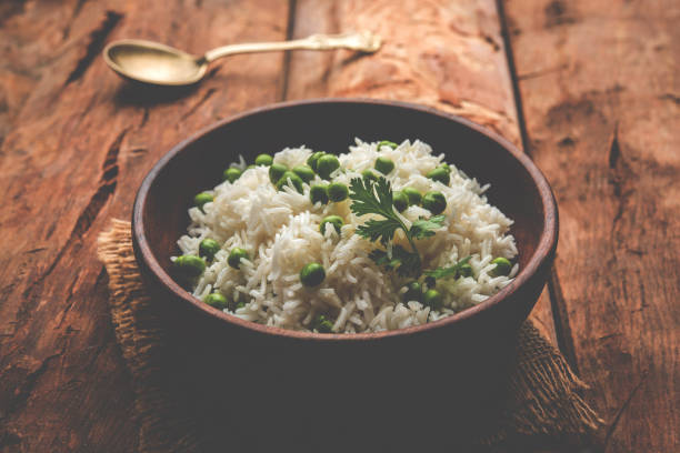 istock Basmati Rice Pilaf or pulav with Peas, or vegetable rice using green peas also known as matar pulav, served with plain dal 898458908