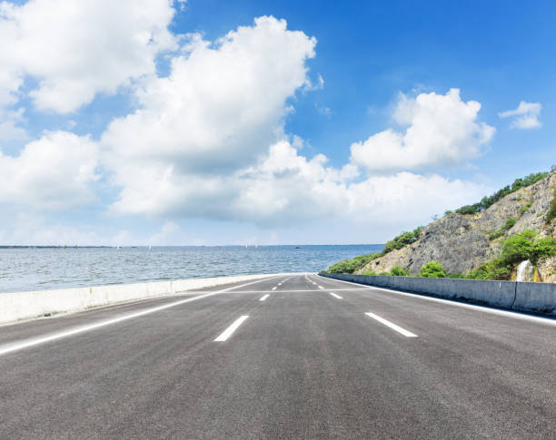 istock asphalt highway and mountain on the edge of the river 898460138
