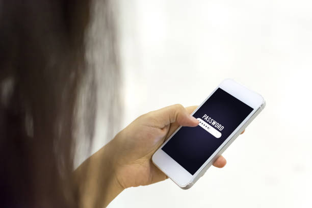 istock Woman hand holding mobile phone and entering password on screen, Smartphone security data protection concept 898466792