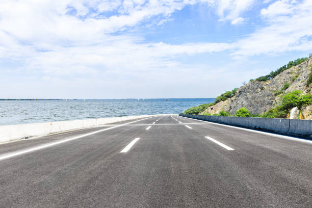istock asphalt highway and mountain on the edge of the river 898467532