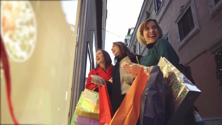 Women shopping during winter christmas sales in Piazza di Spagna and Via dei Condotti in Rome, Italy