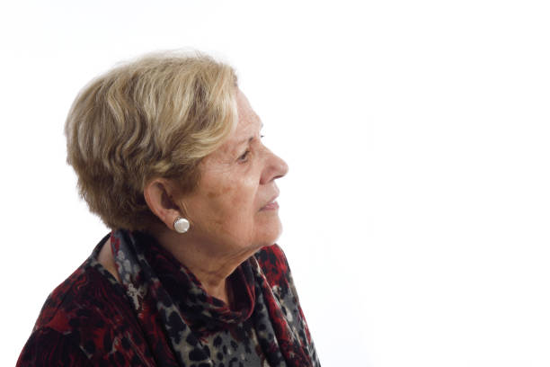 istock Senior woman on white 898474530