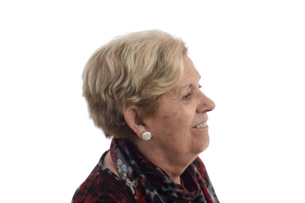 istock Senior woman on white 898474534