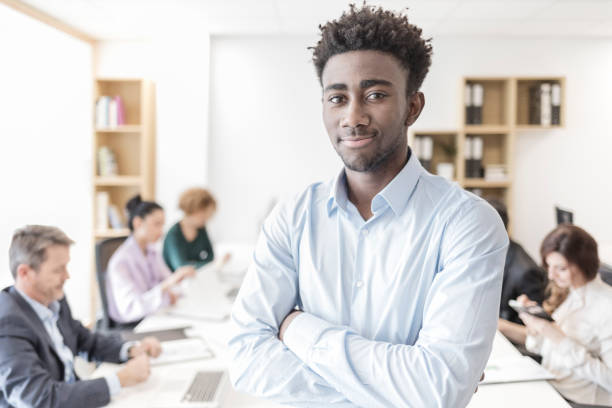istock Office teamwork Smiling african descent businessman working in the office 898475442