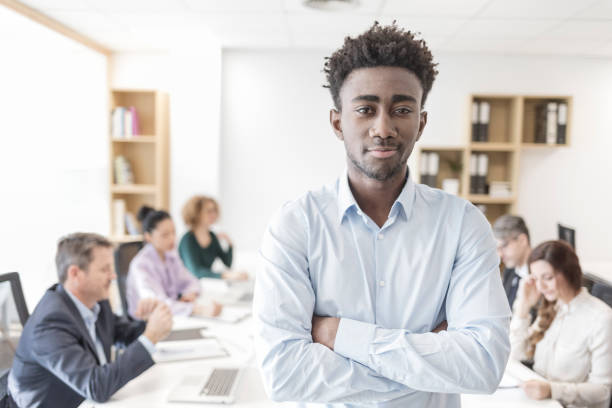 istock Office teamwork Smiling african descent businessman working in the office 898475450