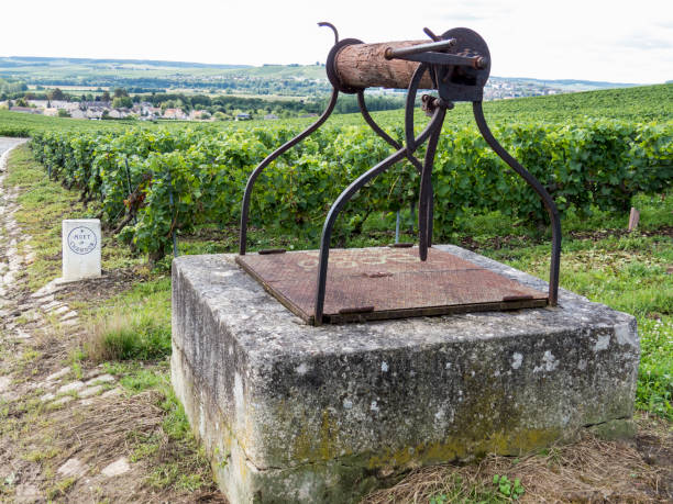 Moet & Chandon in Ay, Champagne, France Ay, Champagne, France - 11 August 2014:  water well in the Hills covered with vineyards in the wine region of Champagne, France. Moet & Chandon moet chandon stock pictures, royalty-free photos & images