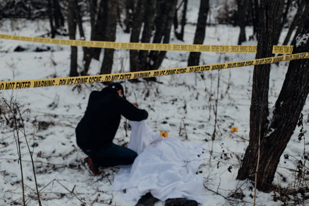 istock Crime scene - identifying dead person in a snow 898475830