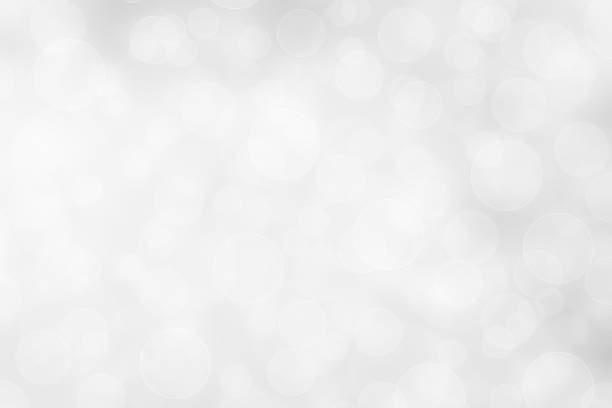 istock silver and white bokeh lights defocused. abstract background 898476000