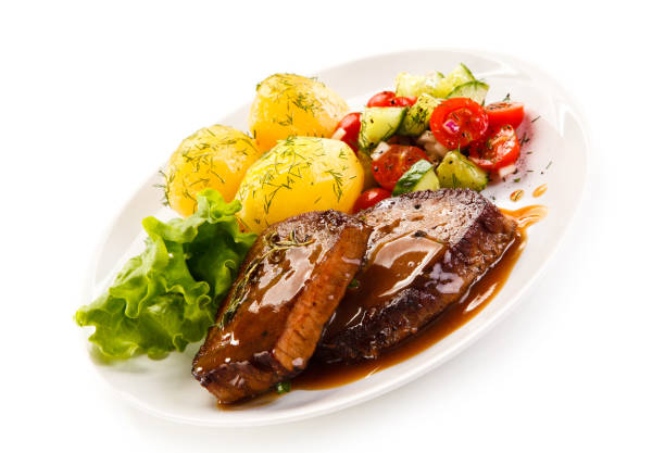 istock Grilled steak with boiled potataoes and vegetables 898479810