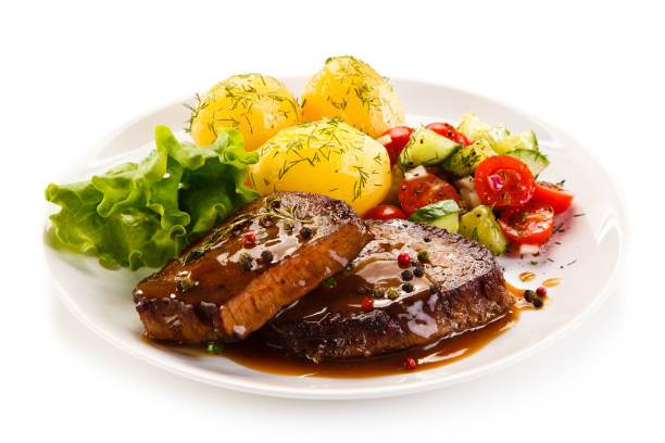 Grilled steak with boiled potataoes and vegetables