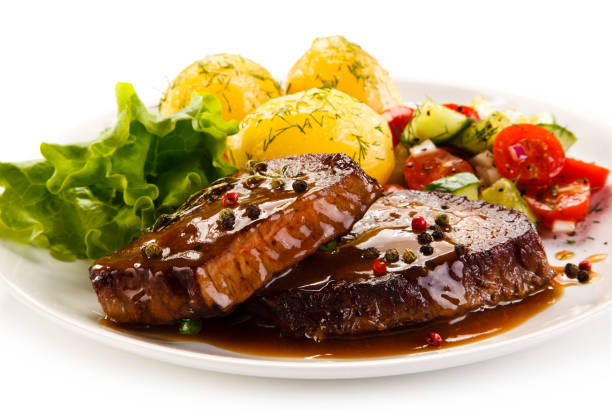 istock Grilled steak with boiled potataoes and vegetables 898479858