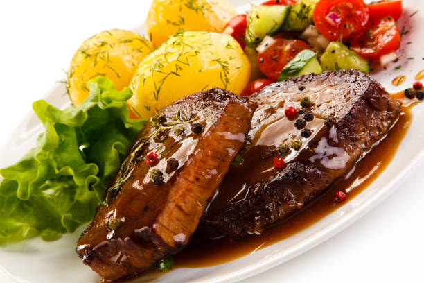 istock Grilled steak with boiled potataoes and vegetables 898479880