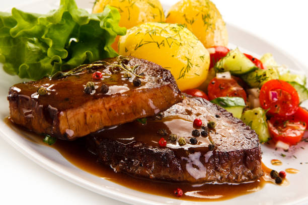 istock Grilled steak with boiled potataoes and vegetables 898479910