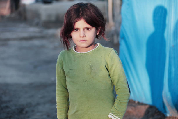 istock little girl in refugee camp 898483472