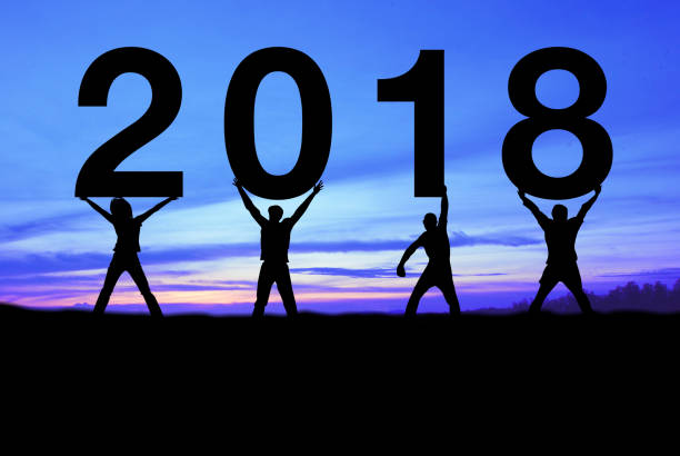 istock Silhouette people happy for 2018 new year. 898484096
