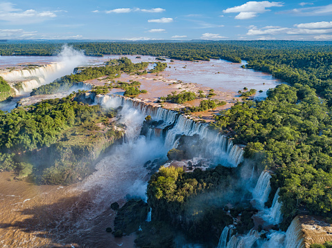 Aerial view of the Lguazu-falls and rainbow at sunny day.