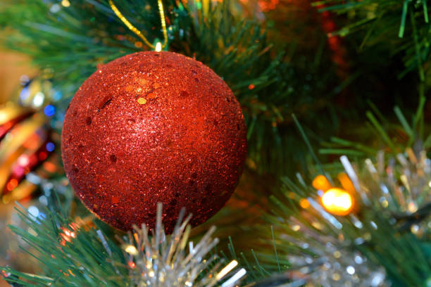 istock christmas balls on tree with lights and stars 898488596