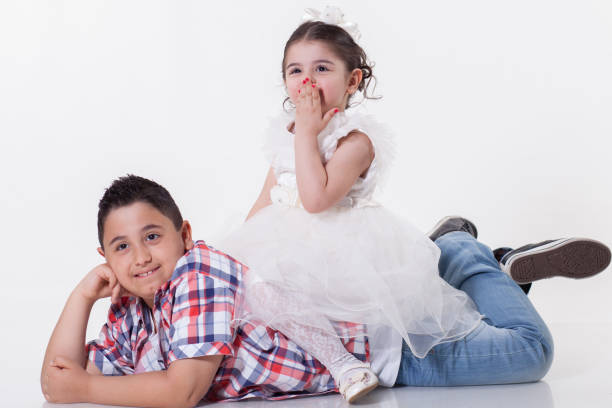 istock Two happy children  over white background 898491952