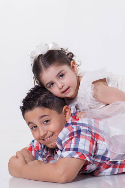 istock Two happy children  over white background 898492204