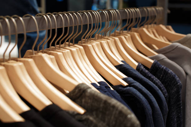 istock womens clothes on wood hangers on rack 898493186