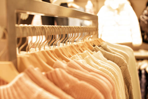 istock womens clothes on wood hangers on rack 898493296