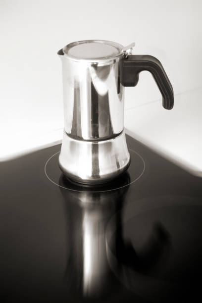 istock Coffee maker on glass-ceramic stove top. 898496818