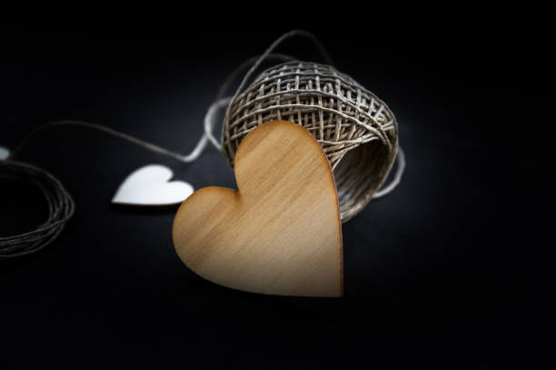 Composition with rustic threads and hearts isolated on background stock photo