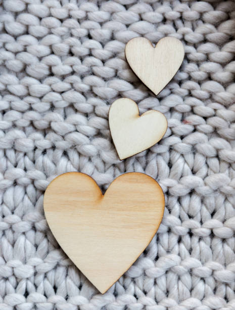 Hearts of wood. Background with wool. stock photo