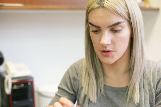 istock Teenage girl putting a make up 898501422