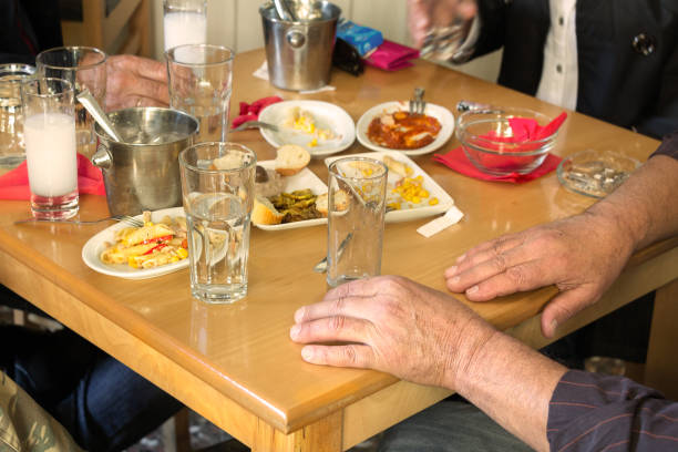 istock Customers drinking ouzo in Larissa, Greece. 898504148
