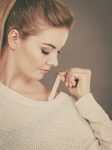 istock Woman holding her bra strap 898516950