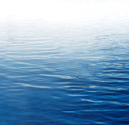 Ripples on blue water surface