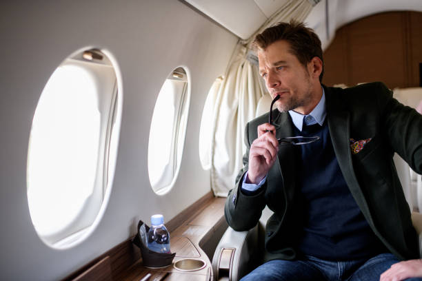 istock Man in private jet airplane 898519810