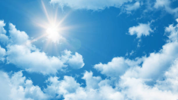 istock Summer Background - blue crystal clear sky with white clouds and sun 898527406