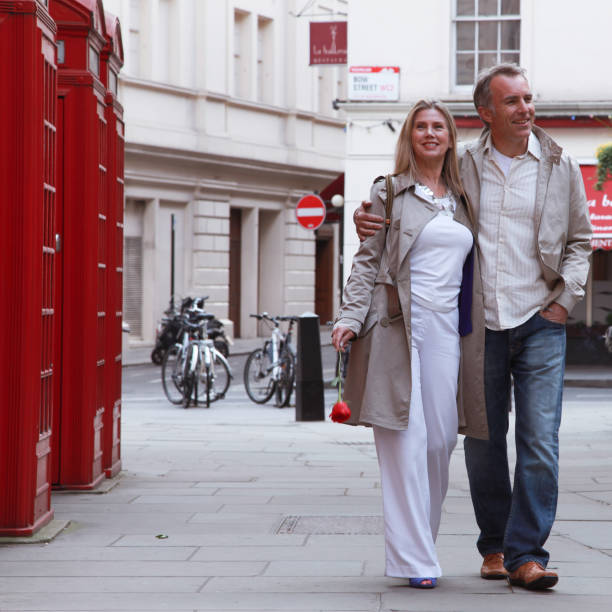 istock romantic couple walking on the street 898527826