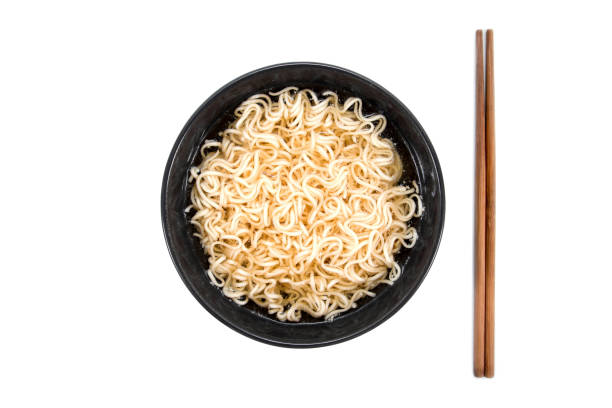 istock Noodles in bowl with chopsticks beside isolated on white background 898534616