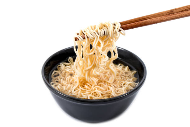 istock Noodle in bowl with bamboo chopsticks isolated on white background 898534922