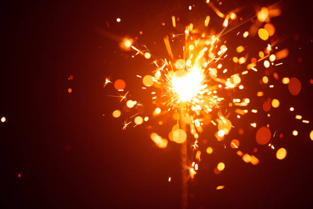 istock Christmas sparkler in haze with red light 898535446