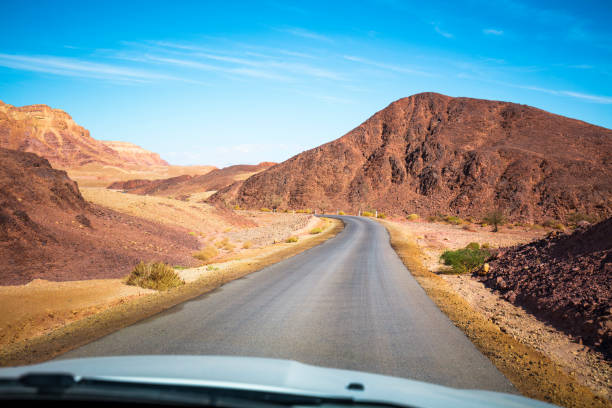 istock Driving a car on a mountain road. 898541086