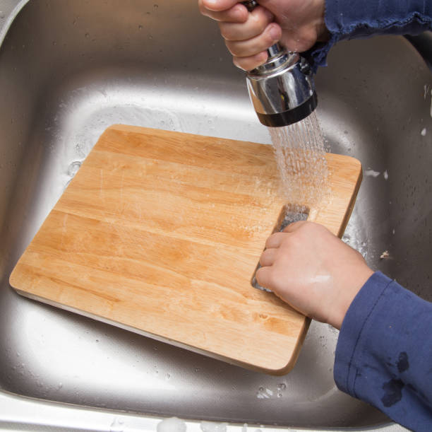 istock boy washing dishes in the kitchen 898548742