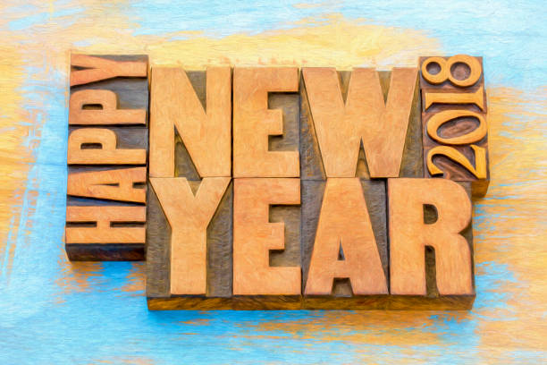 Happy New Year 2018 greeting card - word abstract t in vintage letterpress wood type blocks with a digital painting effect
