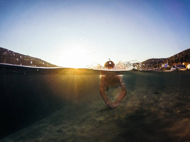 istock Kid swimming in the sea 898559216