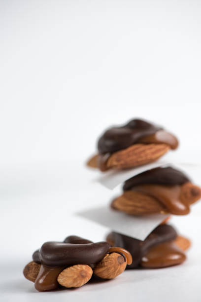 istock Sweet chocolate turtles with almonds and salted caramel. 898559626